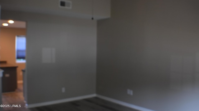 539 Candida Dr, Beaufort, SC 29906 - spare room featuring baseboards, visible vents, and wood finished floors