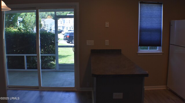 539 Candida Dr, Beaufort, SC 29906 - doorway featuring baseboards and wood finished floors