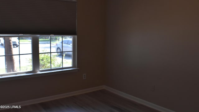 539 Candida Dr, Beaufort, SC 29906 - spare room with baseboards and dark wood-style floors