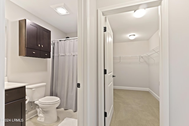 1034 Abbey Glen Way, Hardeeville, SC 29927 - full bathroom with vanity, toilet, a shower with shower curtain, baseboards, and a spacious closet