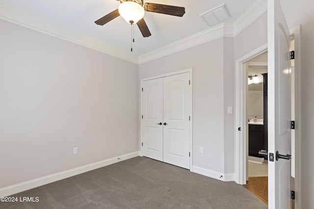 1034 Abbey Glen Way, Hardeeville, SC 29927 - unfurnished bedroom with visible vents, crown molding, baseboards, a closet, and dark colored carpet