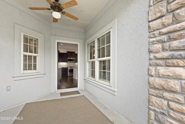 1034 Abbey Glen Way, Hardeeville, SC 29927 - doorway to property featuring a ceiling fan and stucco siding