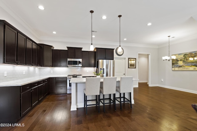 1034 Abbey Glen Way, Hardeeville, SC 29927 - kitchen with dark brown cabinets, a kitchen island with sink, stainless steel appliances, decorative light fixtures, and decorative backsplash