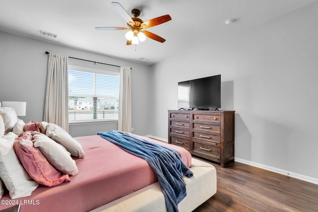 bedroom featuring dark hardwood / wood-style floors and ceiling fan