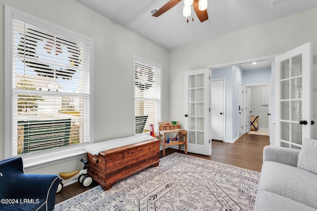 living area featuring french doors, ceiling fan, and hardwood / wood-style flooring