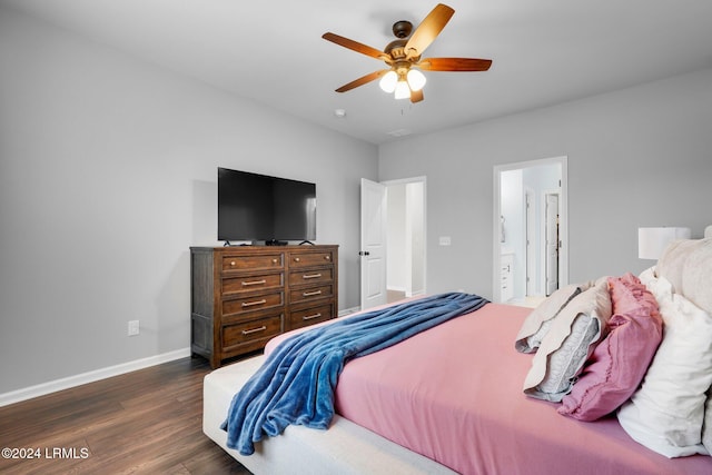 bedroom with ensuite bathroom, dark hardwood / wood-style flooring, and ceiling fan