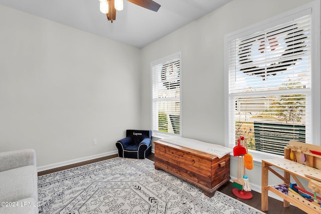 sitting room with ceiling fan and light hardwood / wood-style floors