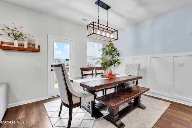 dining space featuring hardwood / wood-style flooring