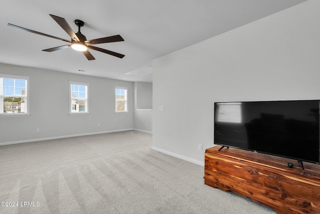 carpeted living room featuring ceiling fan