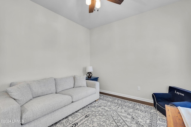 living room with ceiling fan and light wood-type flooring