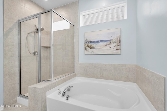 bathroom with shower with separate bathtub