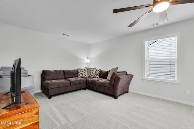 living room with light carpet and ceiling fan