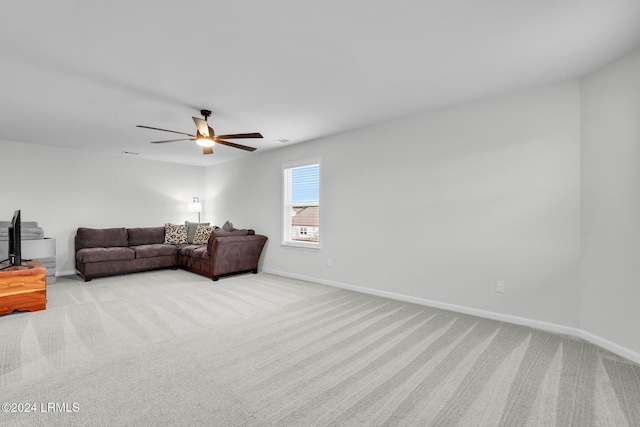 living room featuring light colored carpet and ceiling fan