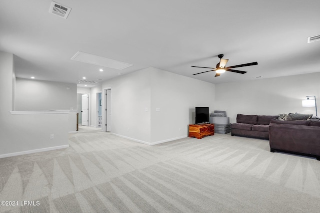 living room featuring ceiling fan and light colored carpet