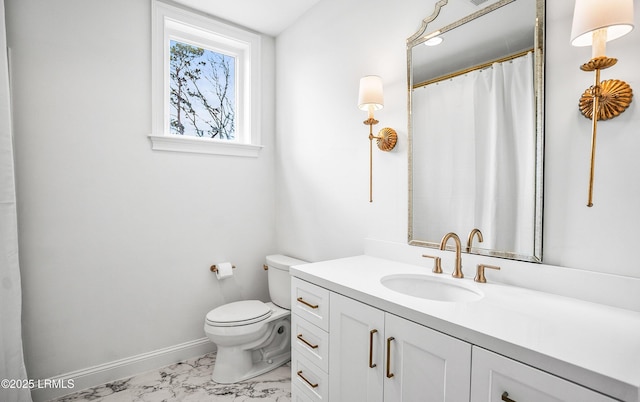 full bathroom featuring toilet, marble finish floor, baseboards, and vanity