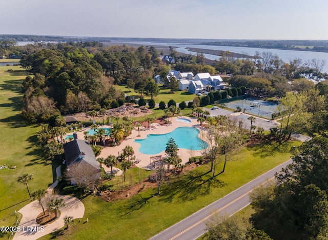 birds eye view of property with a water view