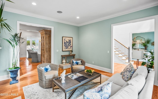 living area featuring recessed lighting, baseboards, stairs, ornamental molding, and light wood-type flooring