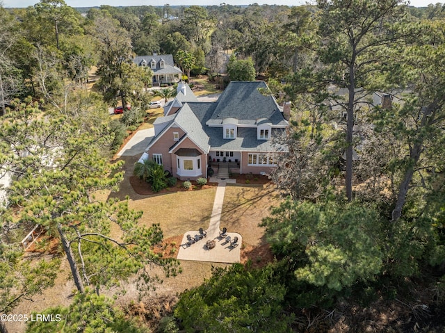 aerial view featuring a view of trees