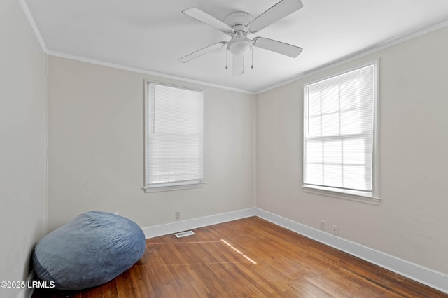 2307 Depot Rd, Beaufort, SC 29902 - unfurnished room featuring crown molding, baseboards, wood finished floors, and visible vents
