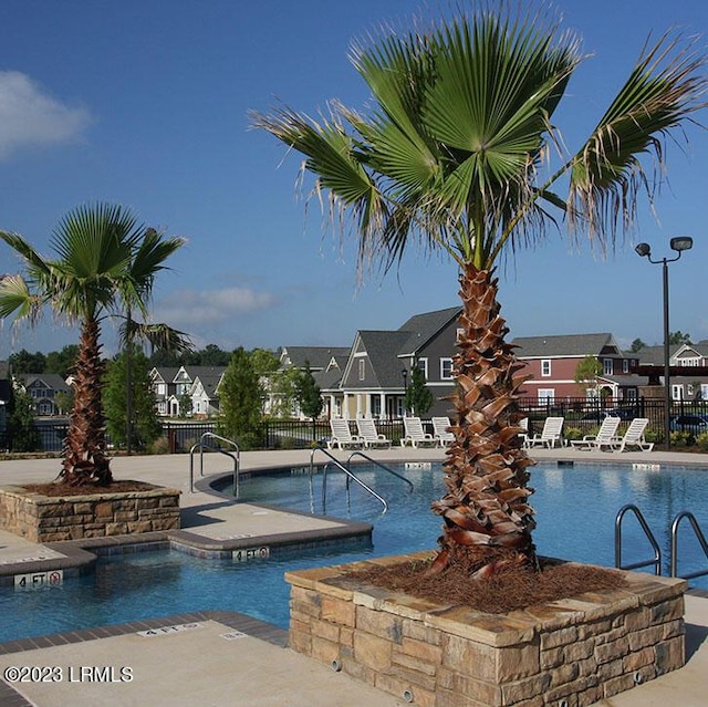 view of swimming pool with a patio