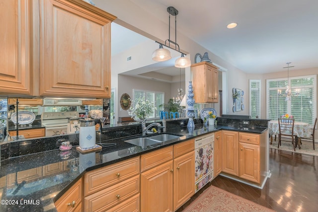 kitchen featuring dark stone counters, pendant lighting, white appliances, and kitchen peninsula