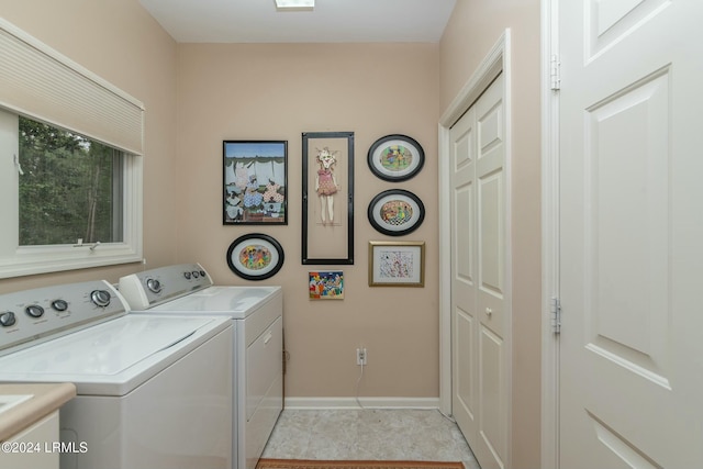 clothes washing area featuring washer and clothes dryer