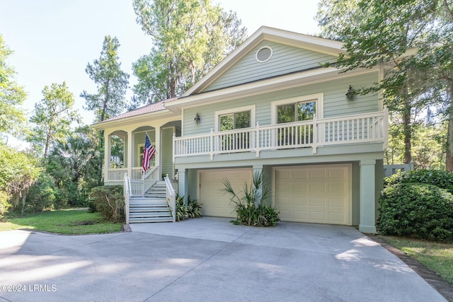 view of front of property featuring a garage and covered porch