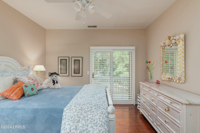 bedroom with dark hardwood / wood-style floors and ceiling fan