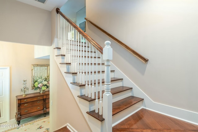 stairway featuring hardwood / wood-style floors