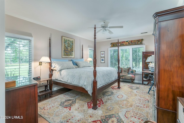 bedroom featuring ornamental molding and ceiling fan