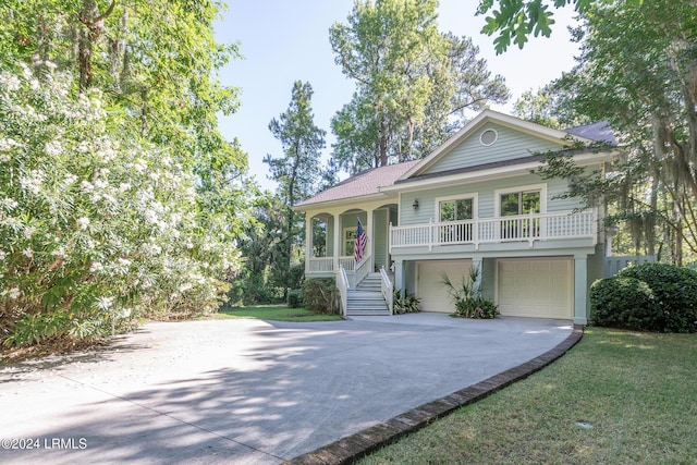 view of front of home featuring a garage and a porch