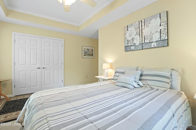 4924 Bluffton Pkwy Unit 18-202, Bluffton, SC 29910 - bedroom with a closet, a tray ceiling, crown molding, and a ceiling fan