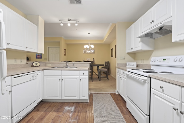 4924 Bluffton Pkwy Unit 18-202, Bluffton, SC 29910 - kitchen with white appliances, under cabinet range hood, a peninsula, white cabinets, and crown molding