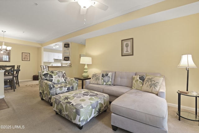 4924 Bluffton Pkwy Unit 18-202, Bluffton, SC 29910 - living area featuring light colored carpet, a ceiling fan, a chandelier, and baseboards