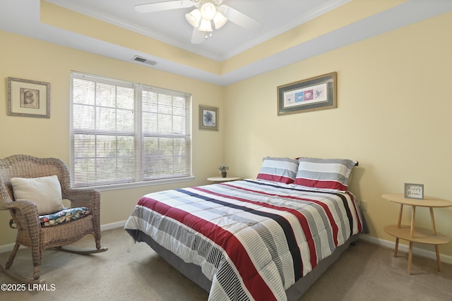 4924 Bluffton Pkwy Unit 18-202, Bluffton, SC 29910 - carpeted bedroom with ornamental molding, baseboards, a tray ceiling, and a ceiling fan