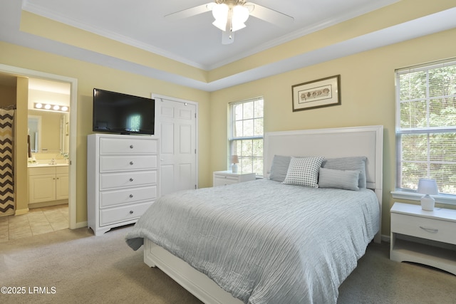 4924 Bluffton Pkwy Unit 18-202, Bluffton, SC 29910 - bedroom with crown molding, light colored carpet, connected bathroom, a closet, and a ceiling fan