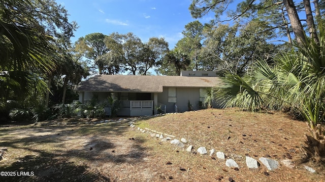 single story home with covered porch