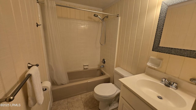 bathroom featuring shower / bath combo with shower curtain, toilet, vanity, and tile patterned flooring