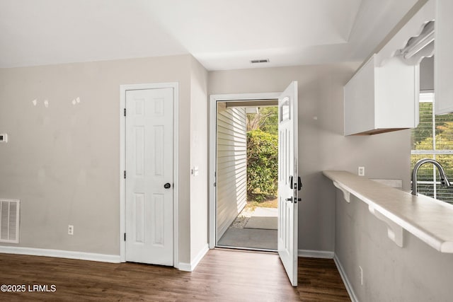2718 Waddell Rd, Beaufort, SC 29902 - entryway with baseboards, visible vents, and wood finished floors