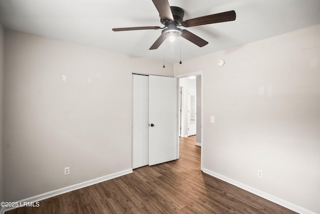 2718 Waddell Rd, Beaufort, SC 29902 - unfurnished bedroom featuring baseboards, ceiling fan, a closet, and wood finished floors