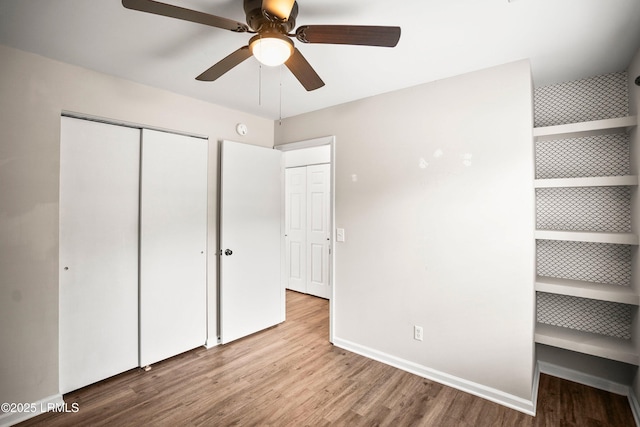 2718 Waddell Rd, Beaufort, SC 29902 - unfurnished bedroom with baseboards, a ceiling fan, a closet, and wood finished floors
