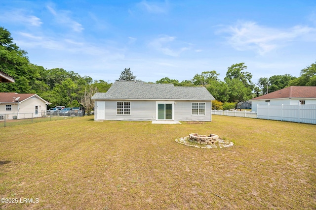 2718 Waddell Rd, Beaufort, SC 29902 - back of house featuring a fenced backyard, a fire pit, and a yard