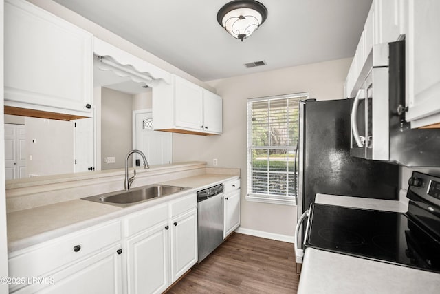 2718 Waddell Rd, Beaufort, SC 29902 - kitchen featuring visible vents, appliances with stainless steel finishes, a sink, baseboards, and white cabinetry