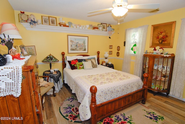 bedroom featuring ceiling fan and wood-type flooring