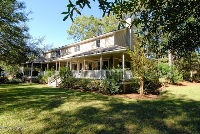 farmhouse inspired home featuring a front yard and a porch