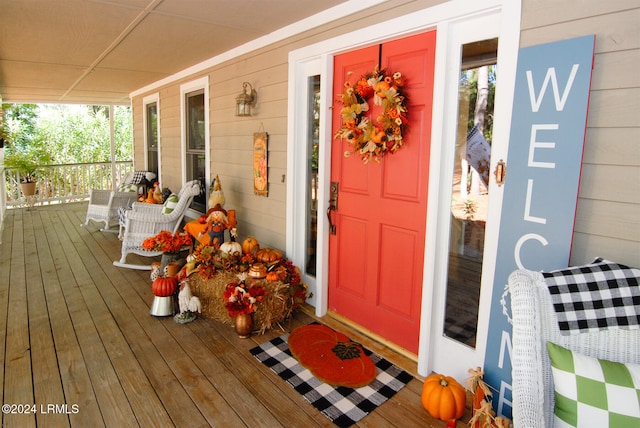 view of exterior entry featuring a porch