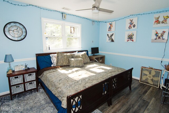 bedroom featuring dark wood-type flooring and ceiling fan