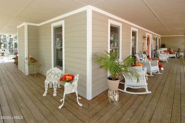 wooden deck featuring covered porch