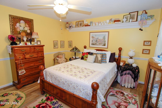 bedroom with ceiling fan and light wood-type flooring