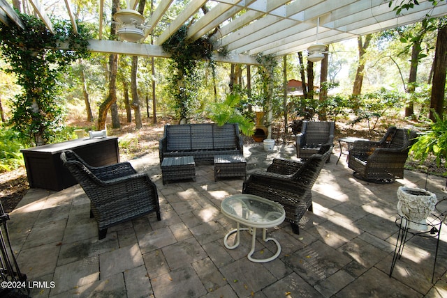 view of patio featuring outdoor lounge area and a pergola